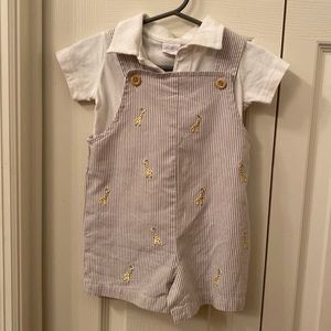 Tan with white strips overalls with white polo.